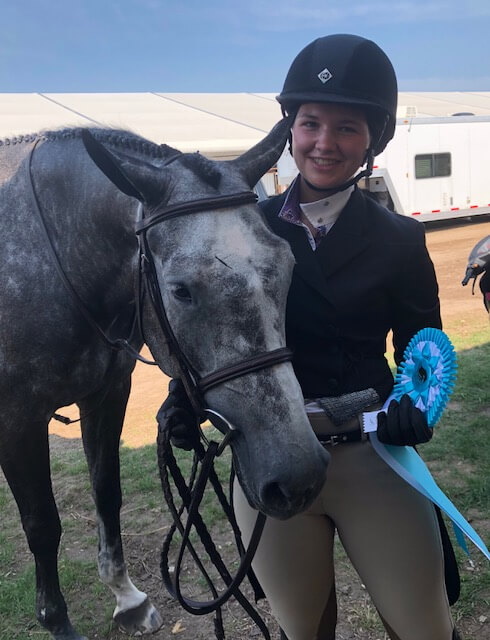 IMG_7804 Girl smiling and posing with grey horse