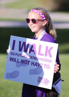 Kayleigh Wieska (1) Girl in purple clothes outside holding sign