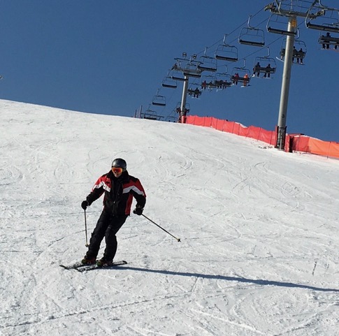 IMG_0044 man in red and black jacket skiing down snow covered hill